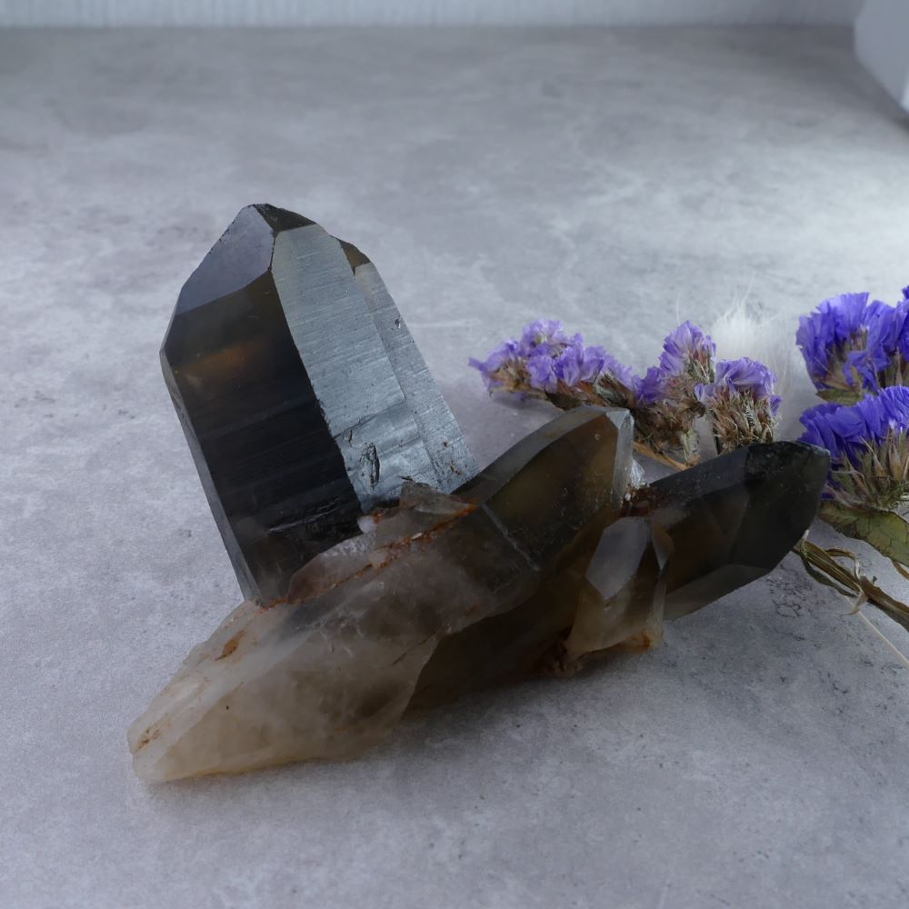 Embrace Inner Strength with Dumi's Crystals (4.5cm x 7.5cm x 4cm, 127g). Irradiated Smoky Quartz Cluster - amplified energy for grounding & protection.