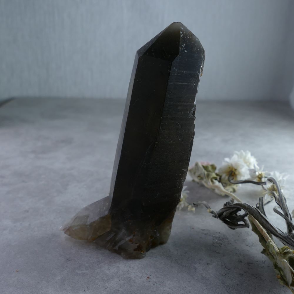 Smoky Quartz for Self-Discovery - Dumi's Crystals (96g). Intriguing formation (2.3cm x 8.3cm x 3cm) in smoky hues with amplified properties. Promotes grounding, protection, & self-exploration.