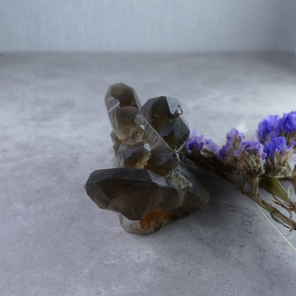 Unleash Inner Strength with Dumi's Crystals (4.8cm x 7cm x 3.6cm, 125g). Smoky Quartz Cluster in rich hues promotes grounding & positive change.
