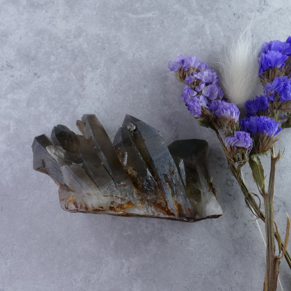 Unique Smoky Quartz Cluster - Dumi's Crystals (125g). Striking landscape within a cluster (4.8cm x 7cm x 3.6cm). Rich smoky hues with grounding and transformative energy.