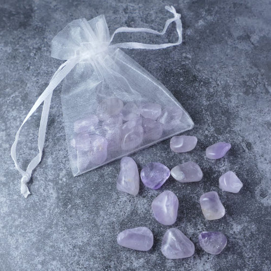 Dumi's Crystals | Light Amethyst Chips Pouch (20g) | A luxurious organza pouch overflowing with Light Amethyst chips, showcasing their soft lavender hues. Light Amethyst is known for its calming energy, promoting inner peace, clarity, and creative inspiration.