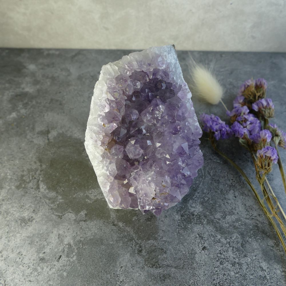 Dumi's Crystals | Lavender Amethyst Cluster (8.9 x 6.3 x 6.3cm) | Holding a Lavender Amethyst Cluster (8.9 x 6.3 x 6.3cm) in your hand. Let its gentle energy wash over you, promoting relaxation, inner peace, and spiritual connection.