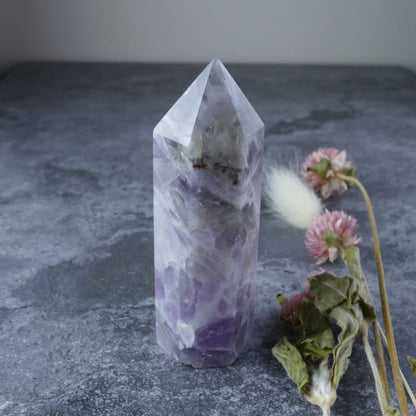 Amethyst's calming energy meets Quartz's amplifying power in this beautiful crystal tower.