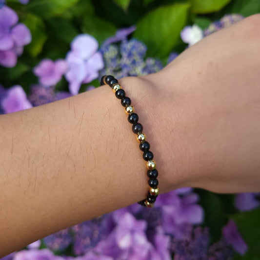 Dumi's Crystals Black Obsidian Bracelet with Gold Accents 7inch for Protection & Strength. Black gemstone bracelet with gold accents for stress relief & grounding. 