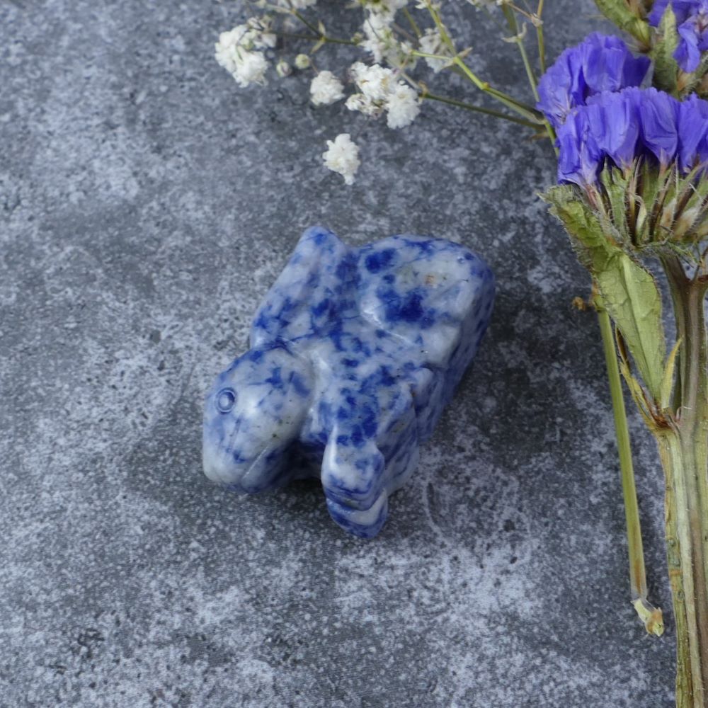 Dumi's Crystals | Blue Spot Jasper Bunny Carving (Peaceful Journey):  An adorable Blue Spot Jasper Crystal Bunny Carving, a reminder of life's peaceful journey. Blue Spot Jasper promotes tranquility & emotional balance. Let this bunny guide you with serenity & grace. Ethically sourced crystals from Dumi's Crystals.