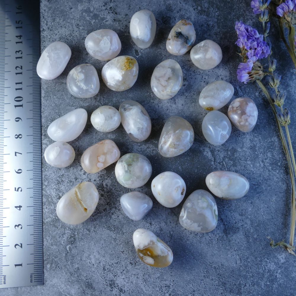 Dumi's Crystals - Flower Agate Tumbled Stones - Delicate beauty meets powerful energy. These captivating stones (1.5-2cm) in soft pinks and creams promote gentle growth.