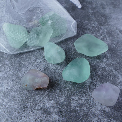 Dumi's Crystals | Fluorite Chips (1-3cm) | Close-up of a collection of genuine Fluorite chips, highlighting their dazzling variations in color and texture. Fluorite is revered for its ability to enhance focus, clarity, and emotional balance.
