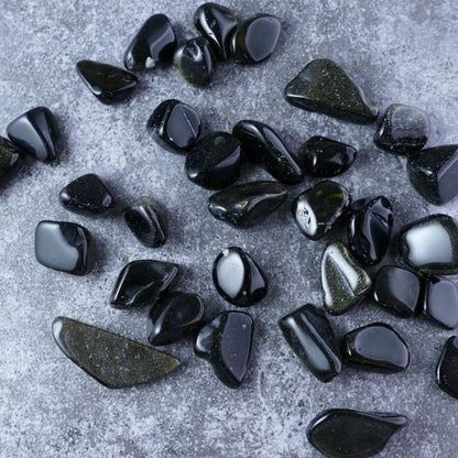 Golden Gold Obsidian chips for protection & strength (1-2cm) | Dumi's Crystals | Enhance your sense of security and inner strength with these genuine Gold Obsidian chips. Ranging from 1 to 2 centimeters, these chips promote protection from negativity, self-discovery, and spiritual resilience.