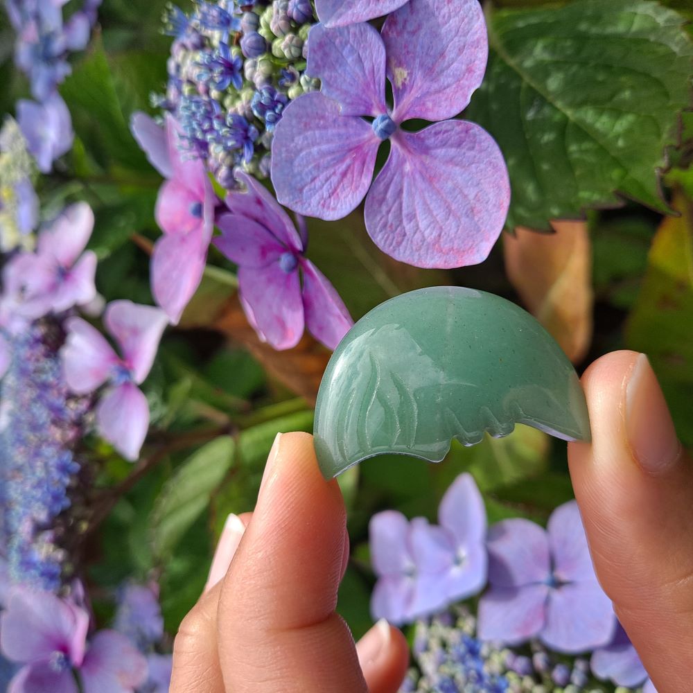 Dumi's Crystals Green Aventurine Moon Face Carving (34x20x6mm): A celestial charm bathed in luck & prosperity. Green Aventurine fosters growth, positivity & inner peace.