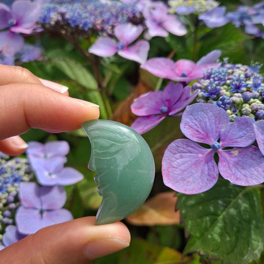 Dumi's Crystals Green Aventurine Moon Face Carving (34x20x6mm): A celestial charm bathed in luck & prosperity. Green Aventurine fosters growth, positivity & inner peace.