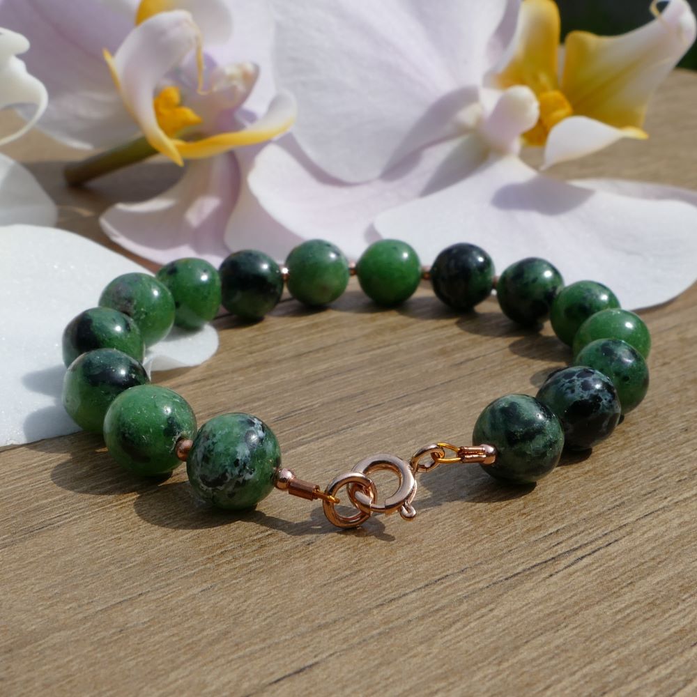 image of a green zoisite and rose gold plated beads handmade bracelet. this bracelet is sold by dumi's crystals