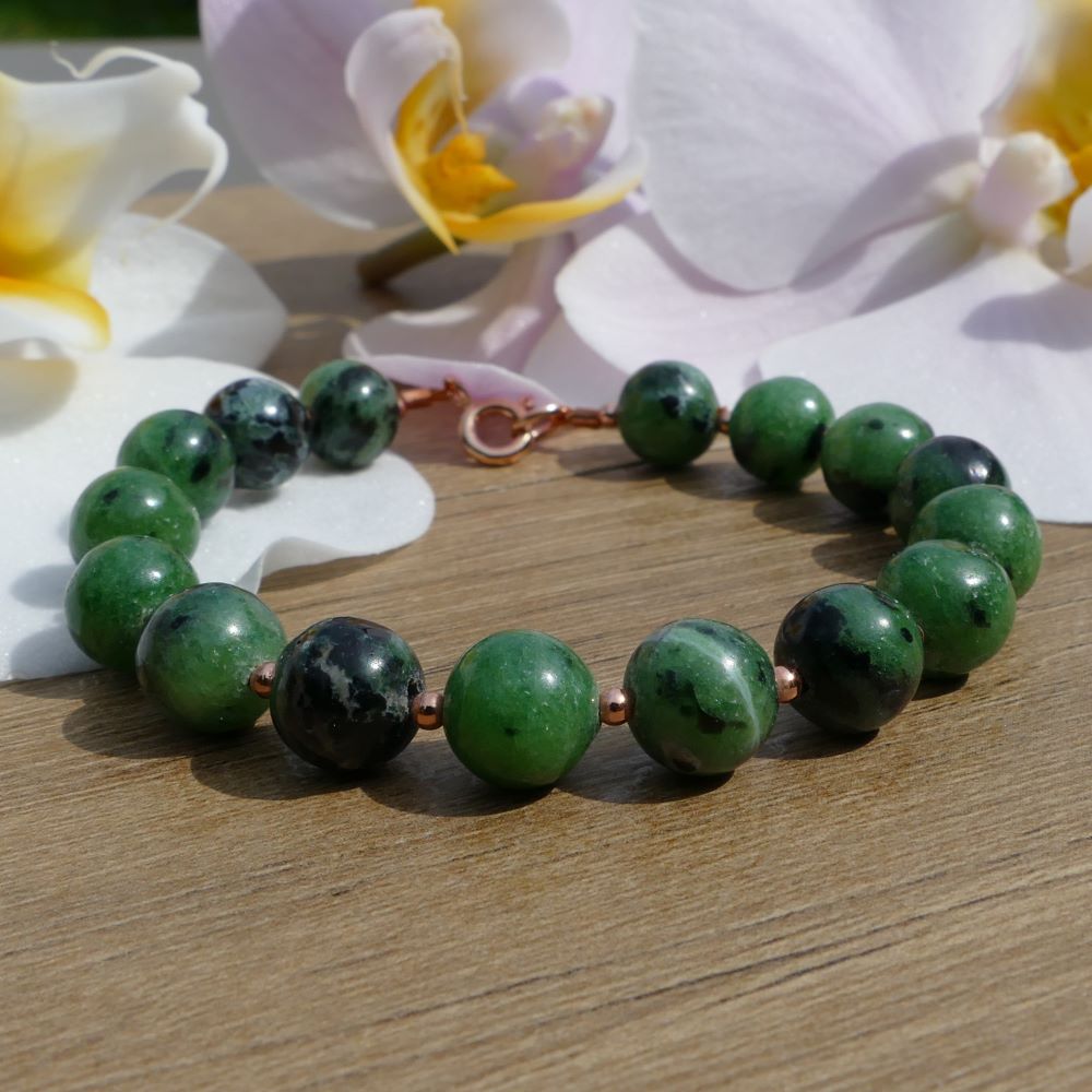 image of a green zoisite and rose gold plated beads handmade bracelet. this bracelet is sold by dumi's crystals
