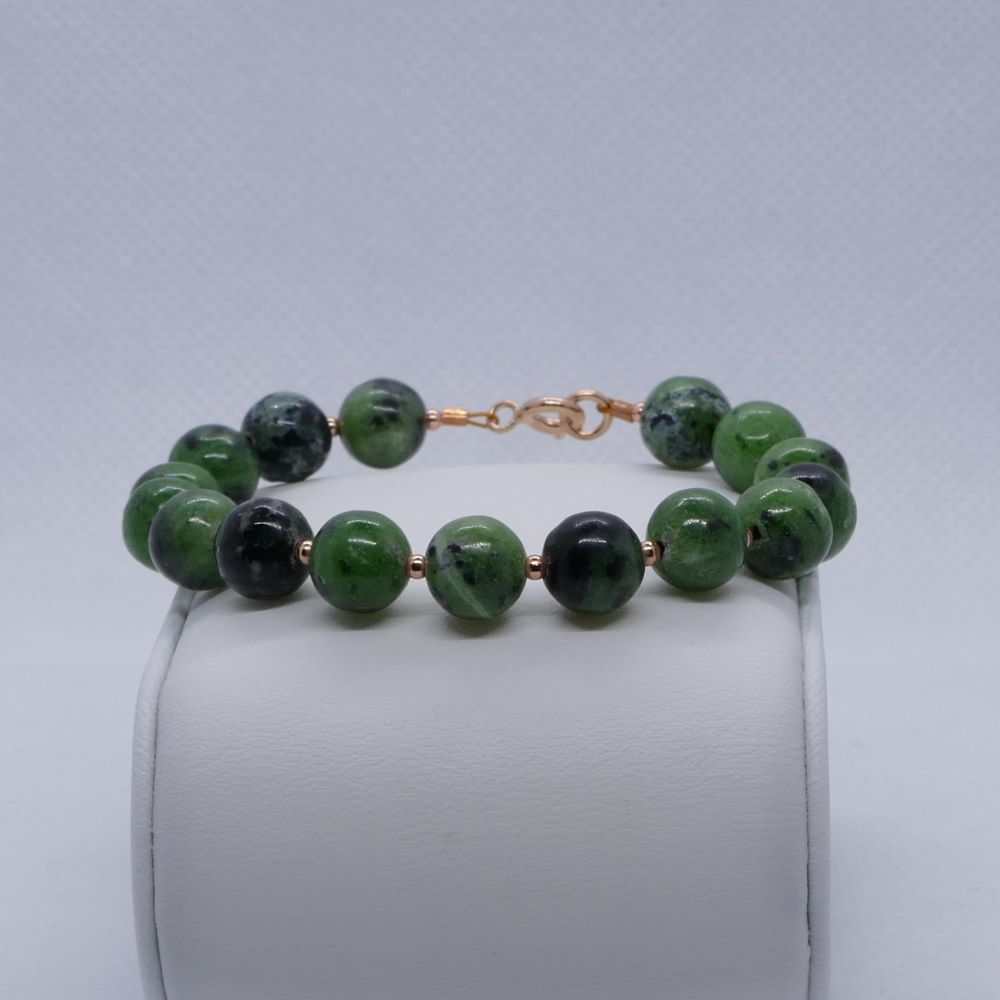 image of a green zoisite and rose gold plated beads handmade bracelet. this bracelet is sold by dumi's crystals
