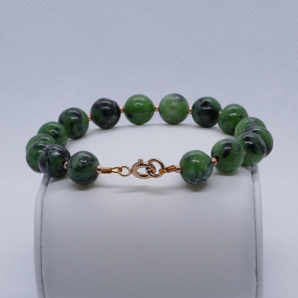image of a green zoisite and rose gold plated beads handmade bracelet. this bracelet is sold by dumi's crystals