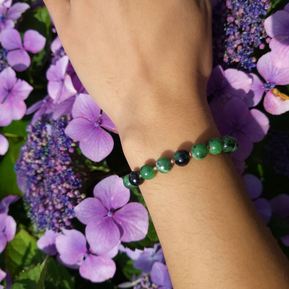 image of a green zoisite and rose gold plated beads handmade bracelet. this bracelet is sold by dumi's crystals