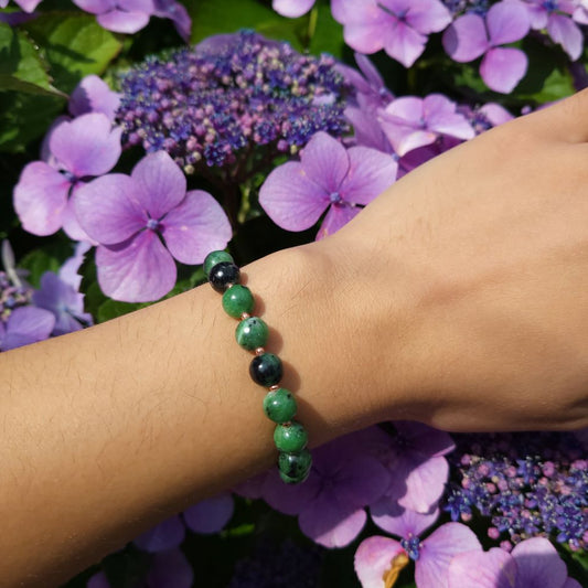 image of a green zoisite and rose gold plated beads handmade bracelet. this bracelet is sold by dumi's crystals