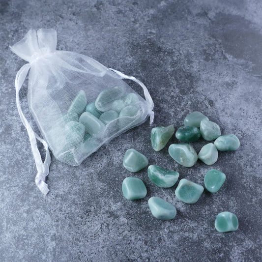 Dumi's Crystals | Green Aventurine Chips Pouch (20g) | A luxurious organza pouch overflowing with Green Aventurine chips, showcasing their lush green hues and variations in size. Green Aventurine is known for attracting abundance, promoting emotional healing, and fostering creativity.