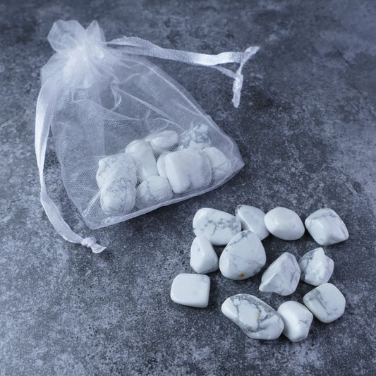 Dumi's Crystals | Howlite Chips Pouch (20g) | A luxurious organza pouch overflowing with Howlite chips, showcasing their calming white hues and variations in size. Howlite is known as a stone of inner peace, promoting emotional balance and restful sleep.