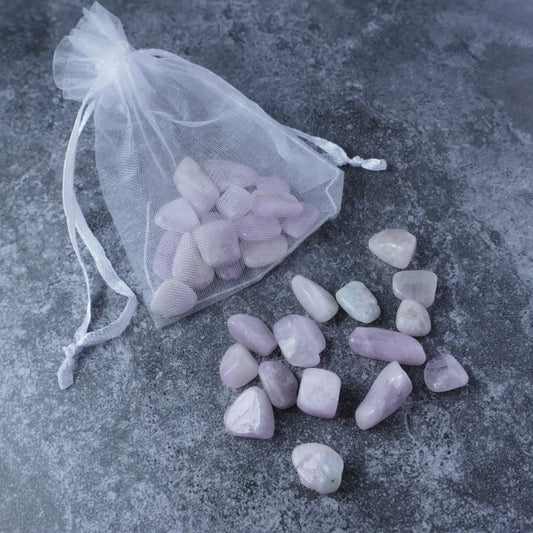 Dumi's Crystals | Kunzite Chips Pouch (20g) | A luxurious organza pouch overflowing with Kunzite chips, showcasing their delicate pink hues and variations in size. Kunzite is known as a stone of love and emotional healing, promoting self-love, peace, and emotional well-being.