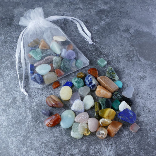 Dumi's Crystals | Mixed Crystal Chips Pouch (50g) | A captivating organza pouch overflowing with a vibrant mix of assorted crystal chips. Each chip offers unique healing properties and positive energy. Explore a world of well-being and create a harmonious blend for your space.