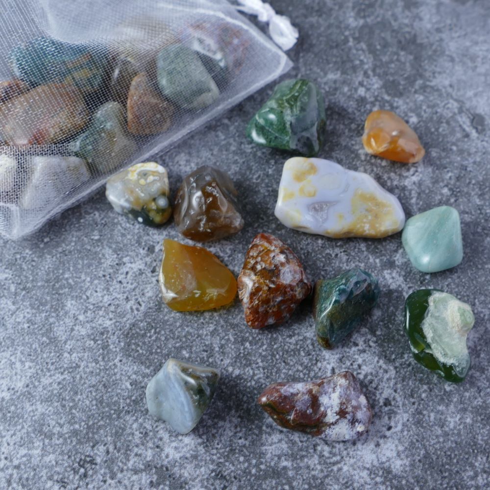 Dumi's Crystals | Ocean Jasper Chips (1-2.5cm) | Close-up of a collection of genuine Ocean Jasper chips, highlighting their captivating variations in color and pattern. Ocean Jasper is revered for its ability to promote emotional healing, tranquility, and loving connections.