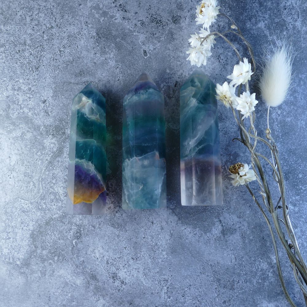Multicolored Fluorite Crystal Tower - A captivating tower showcasing the natural beauty of fluorite with its unique blend of colors. Ideal for meditation, crystal healing, or home decor.