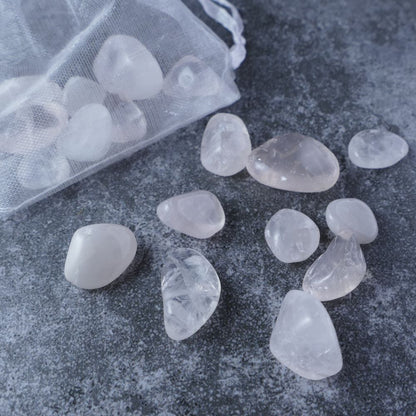 Dumi's Crystals | Rose Quartz Chips (1-2.5cm) | Close-up of a collection of genuine Rose Quartz chips, showcasing their soft pink hues and variations in size and texture. Rose Quartz is revered for its ability to promote love, emotional healing, and inner peace.
