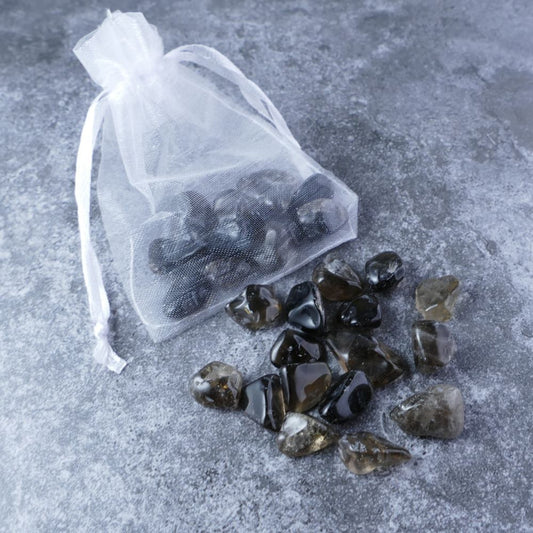 Dumi's Crystals | Smoky Quartz Chips Pouch (20g) | A luxurious organza pouch overflowing with Smoky Quartz chips, showcasing their smoky translucency. Smoky Quartz is known for its purifying and protective properties, promoting emotional clarity, peace, and a grounded spirit.
