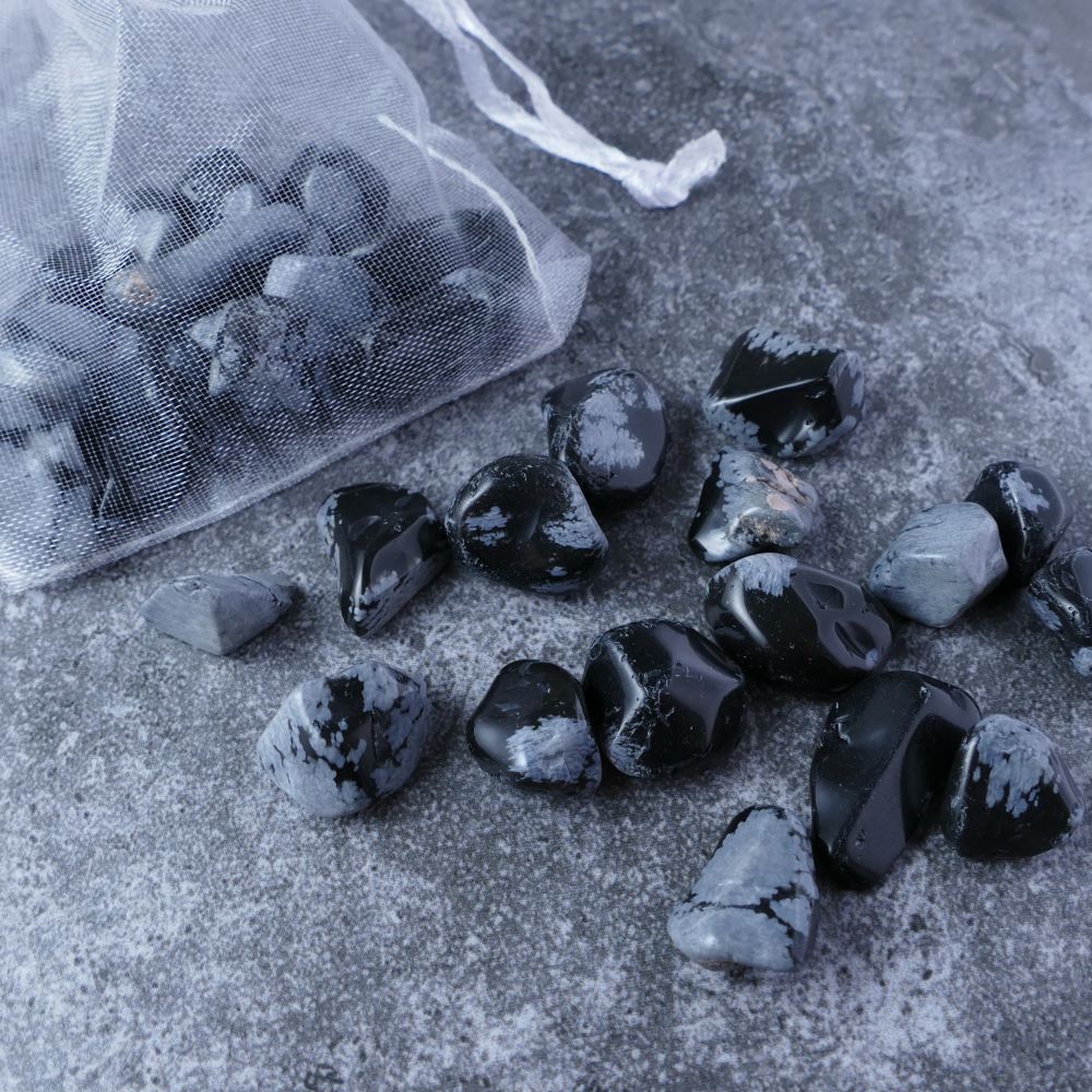 Snowflake obsidian chips pouch for transformation & balance (20g) | Dumi's Crystals | Cultivate inner peace, self-discovery, and a protective shield with this Snowflake Obsidian Chips Pouch. Genuine chips (1-2.5cm) in a beautiful organza pouch. Promotes negativity release, emotional balance, and spiritual growth.
