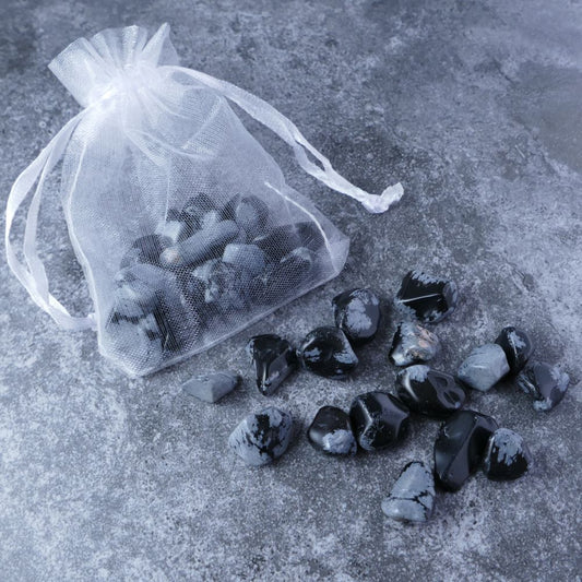 Dumi's Crystals | Snowflake Obsidian Chips Pouch (20g) | A luxurious organza pouch overflowing with Snowflake Obsidian chips, showcasing their captivating black and white patterns. Snowflake Obsidian is known for its transformative energy, promoting inner growth, balance, and a sense of peace.