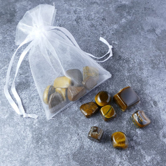 Dumi's Crystals | Tiger's Eye Chips Pouch (20g) | A luxurious organza pouch overflowing with Tiger's Eye chips, showcasing their captivating golden hues. Tiger's Eye is known as a stone of confidence, strength, and protection, promoting courage, determination, and a sense of security.