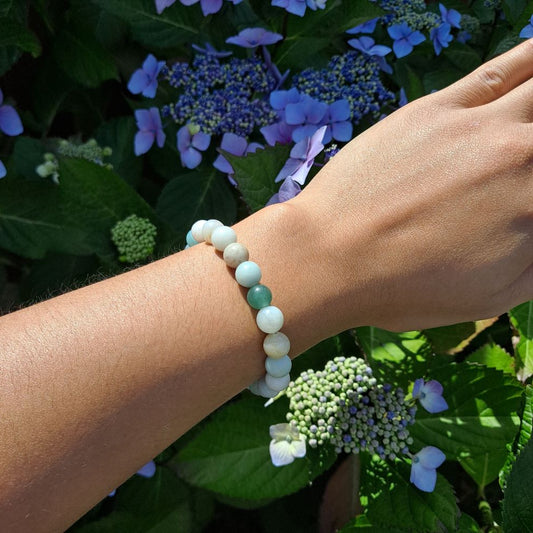 Dumi's Crystals 8mm Amazonite Bracelet: Worn on a wrist.