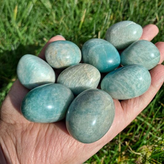 Dumi's Crystals | Amazonite Tumbled Stones |  Hold a collection of calming Amazonite Tumbled Stones in your hand. These stones, ranging from 3-4cm in size, promote harmony, clarity, and emotional balance.