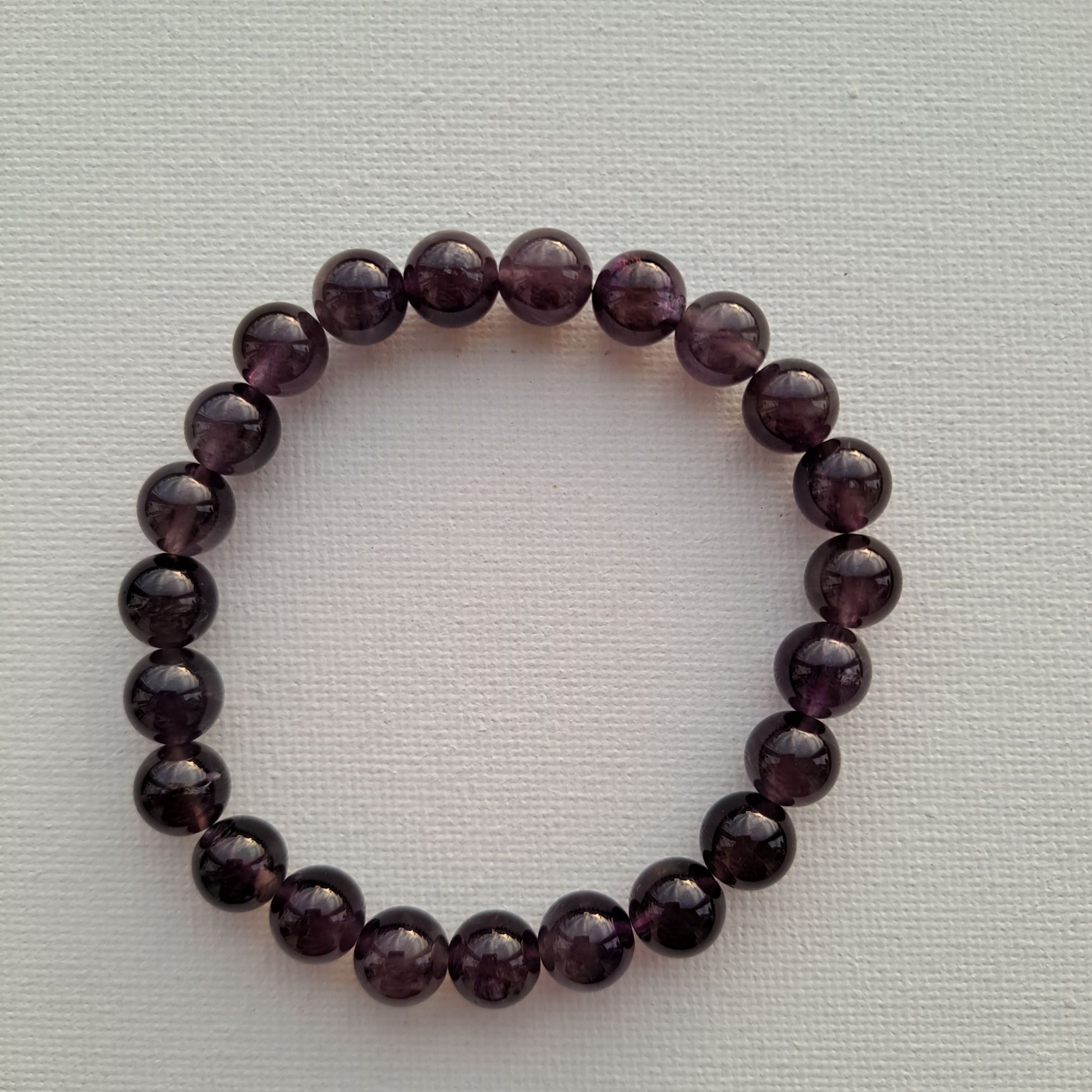 Dumi's Crystals Amethyst Bracelet: Handcrafted with 8mm Amethyst beads for tranquillity, clarity, and spiritual awakening.