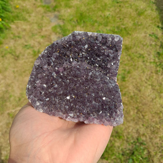 Dumi's Crystals | Amethyst Cluster (Compact, 9cm) | A captivating Amethyst Cluster in a compact size (9 x 6.5 x 9.6cm), showcasing a display of rich purple crystals. Amethyst is believed to promote peace, focus, and emotional balance.