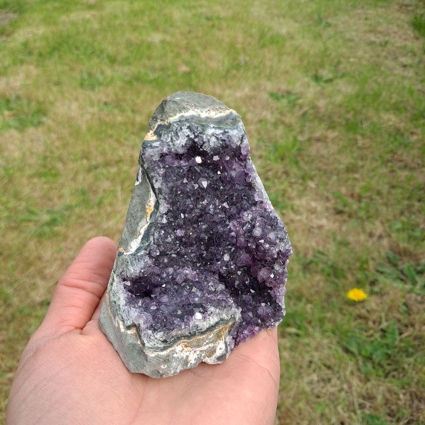 Dumi's Crystals | Amethyst Cluster (Portable, 9cm) in meditation | Close your eyes and hold this Amethyst Cluster (9 x 7.6 x 7.6cm) during meditation. Amethyst is believed to enhance focus, clarity, and spiritual connection.