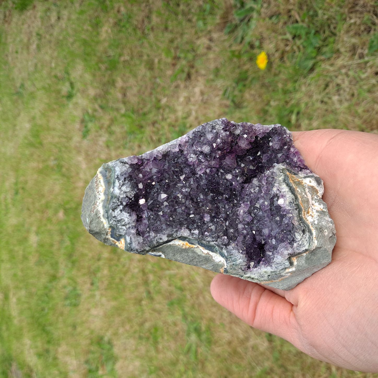 Dumi's Crystals | Amethyst Cluster (Portable, 9cm) in meditation | Close your eyes and hold this Amethyst Cluster (9 x 7.6 x 7.6cm) during meditation. Amethyst is believed to enhance focus, clarity, and spiritual connection.