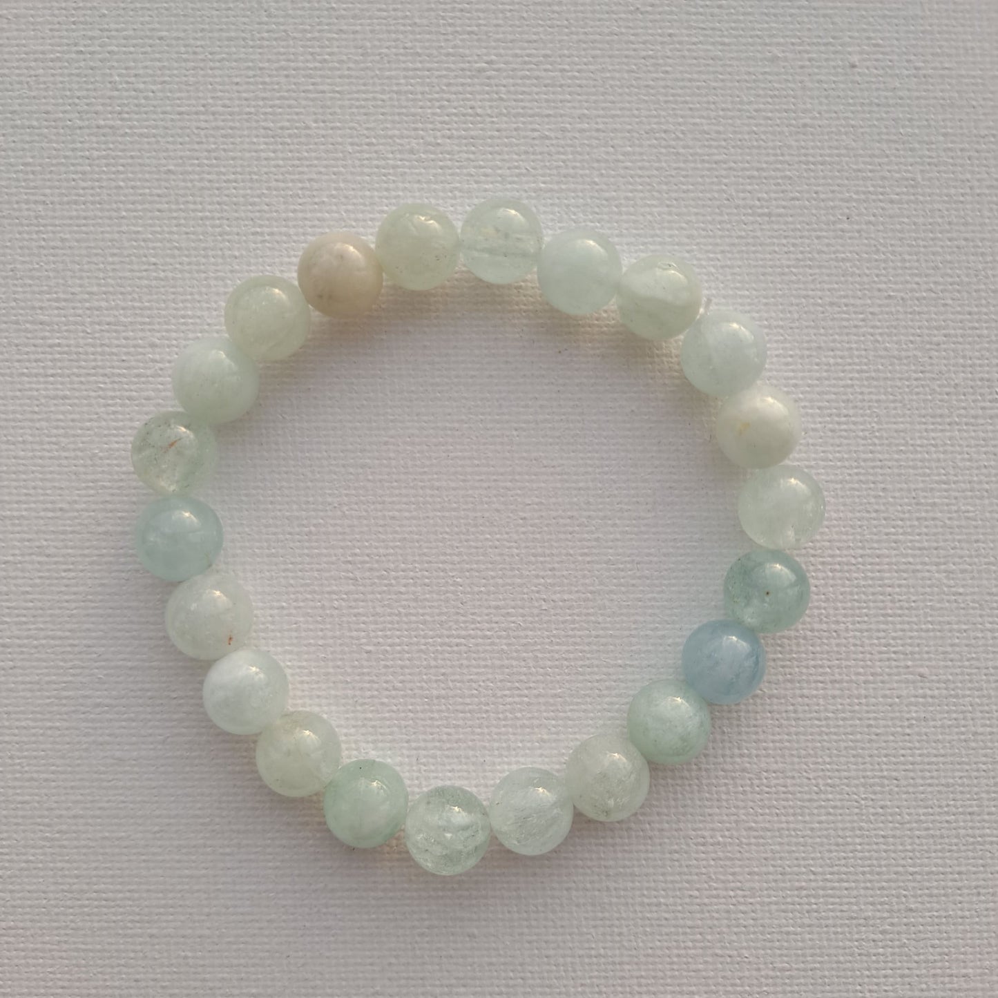 Dumi's Crystals: 8mm Aquamarine Bracelet. Soothing ocean vibes for emotional balance, clear thinking & self-expression.
