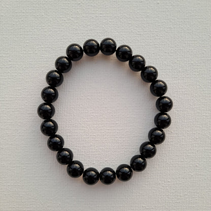 Dumi's Crystals Black Obsidian Bracelet (8mm): Embrace inner power. Genuine black obsidian beads for protection, grounding & spiritual growth.