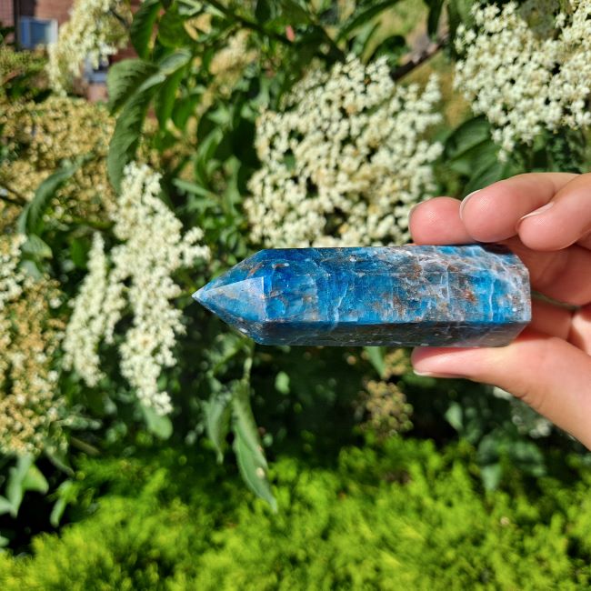Find Your Voice with Blue Apatite Tower | Dumi's Crystals | This Blue Apatite Tower (6-10cm) radiates vibrant energy. Blue Apatite is thought to stimulate the throat chakra, promoting clear communication, creative expression, and manifestation.