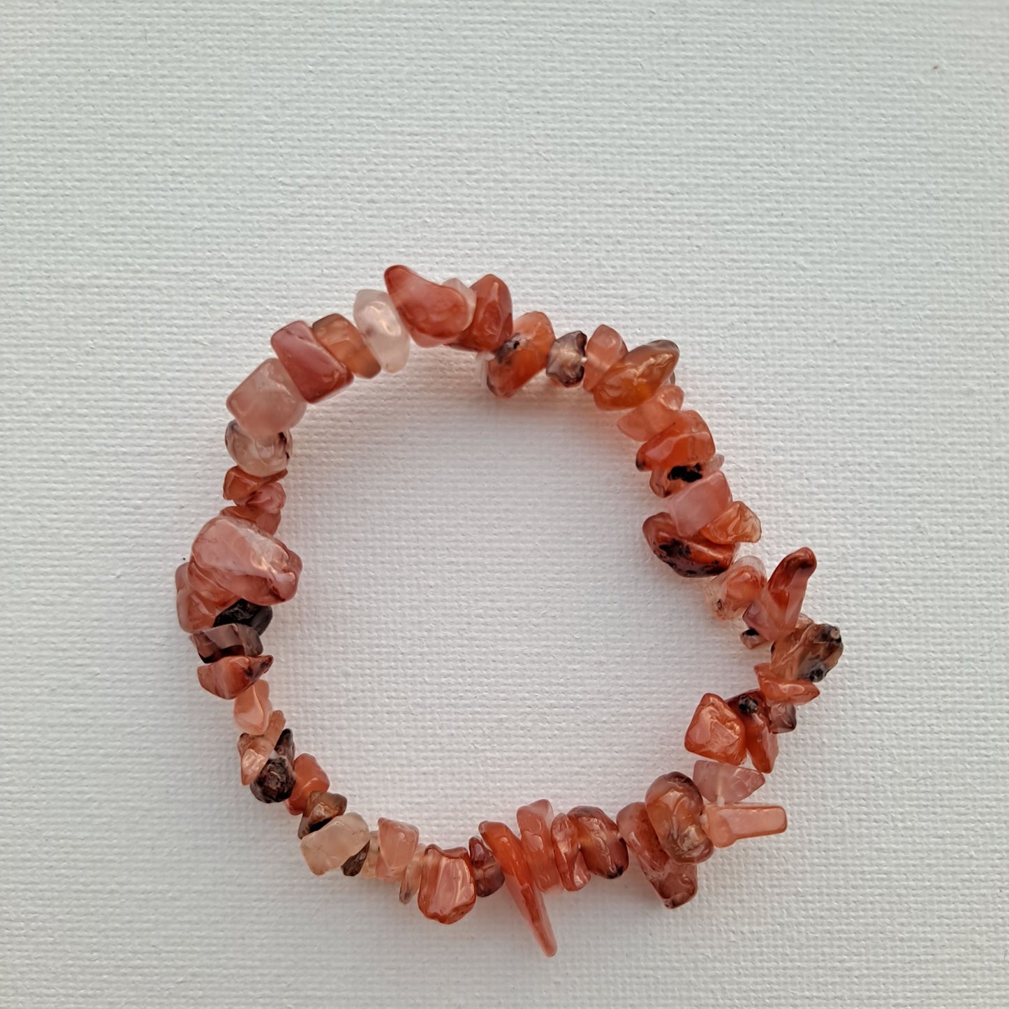 Dumi's Crystals Carnelian Chip Bracelet. Embrace your inner fire! Genuine Carnelian chips in vibrant hues. Boosts motivation, joy & self-expression.