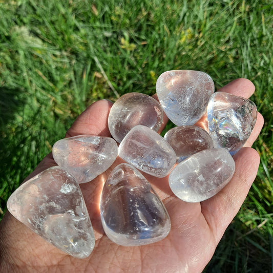 Dumi's Crystals | Clear Quartz Tumbled Stones (Amplify Clarity) | A handful of Clear Quartz Tumbled Stones radiate pure light. Clear Quartz amplifies energy and intentions, promoting mental clarity, focus, and spiritual growth. Hold them during meditation or carry them throughout the day for an energetic boost.