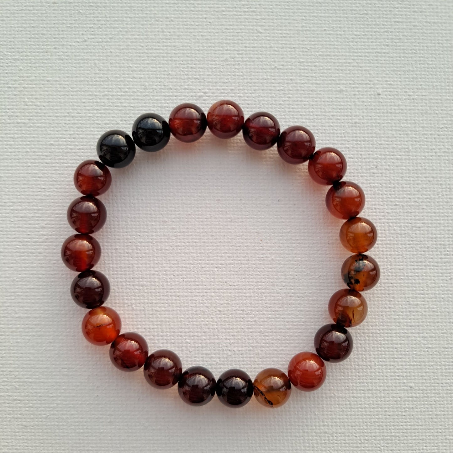 Dumi's Crystals | Dream Agate Stretch Bracelet (7 Inch) | Close-up of a handcrafted bracelet featuring genuine Dream Agate beads with unique swirls and patterns. Dream Agate, a type of agate, is believed to promote intuition and spiritual awakening.