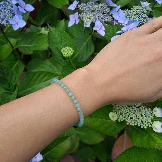 Dumi's Crystals | Green Aventurine Stretch Bracelet (4mm) | Showcasing the calming green hues of Green Aventurine on a wrist. This bracelet features genuine Green Aventurine beads, known for their connection to the heart chakra. Green Aventurine promotes peace, abundance, and personal growth.