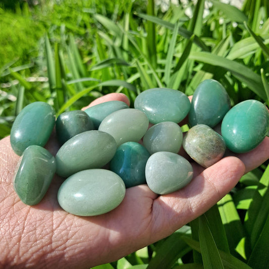 Dumi's Crystals | Green Aventurine Tumbled Stones (Abundance & Prosperity) | A handful of Green Aventurine Tumbled Stones radiate vibrant green hues. Known for attracting success, positive outcomes & emotional balance, hold them during meditation or carry them throughout the day to cultivate abundance and joy.