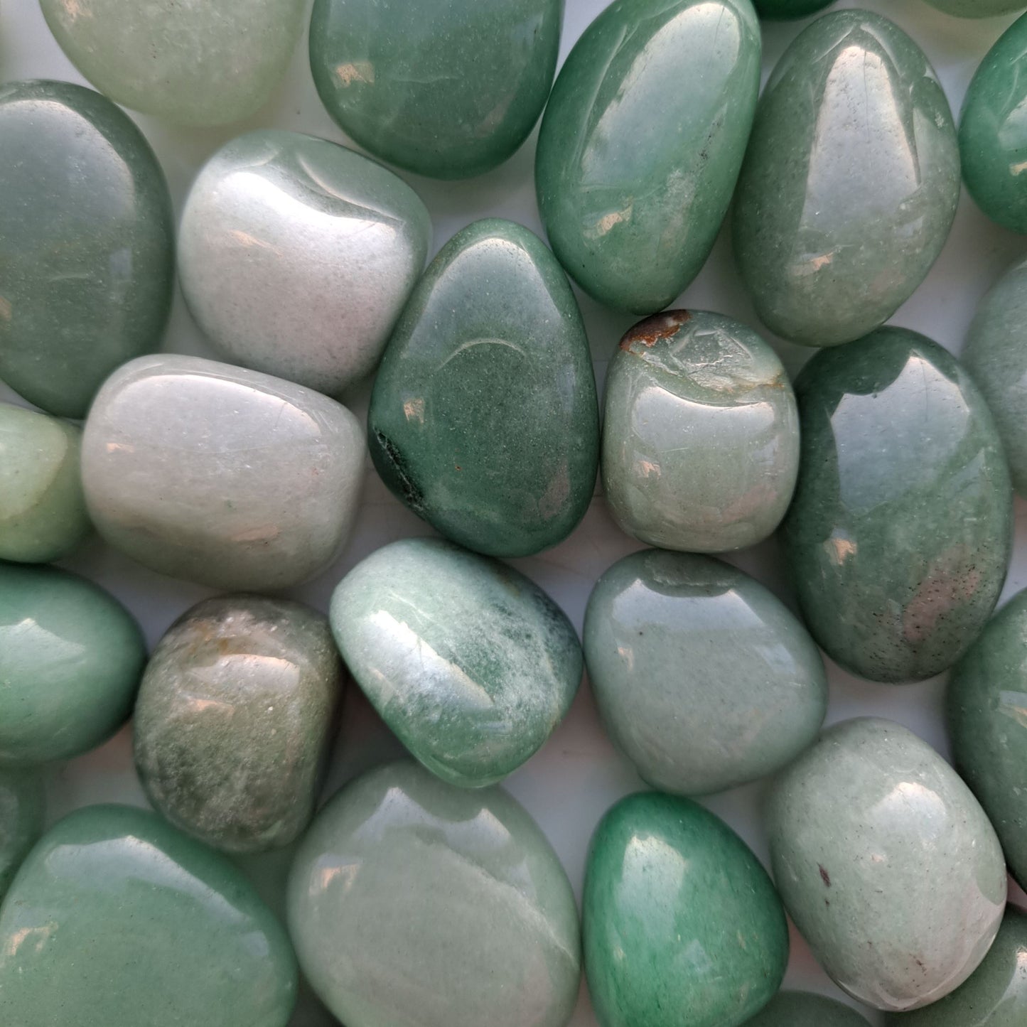 Dumi's Crystals | Green Aventurine Tumbled Stones (Growth & Harmony) | A collection of Green Aventurine Tumbled Stones, each a testament to nature's beauty. Green Aventurine promotes emotional well-being, inner peace & new beginnings. Scatter them in your home or workspace to cultivate a space overflowing with positive energy and growth.