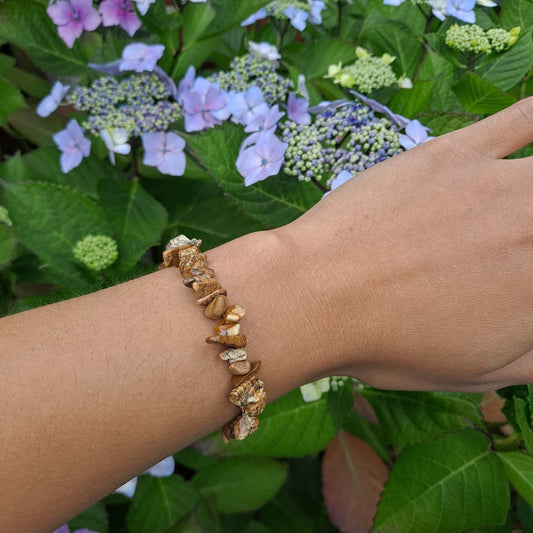 Picture Jasper bracelet on wrist | Dumi's Crystals | This stylish 7-inch stretch bracelet features genuine picture jasper chips, known for their grounding energy and beautiful landscapes.