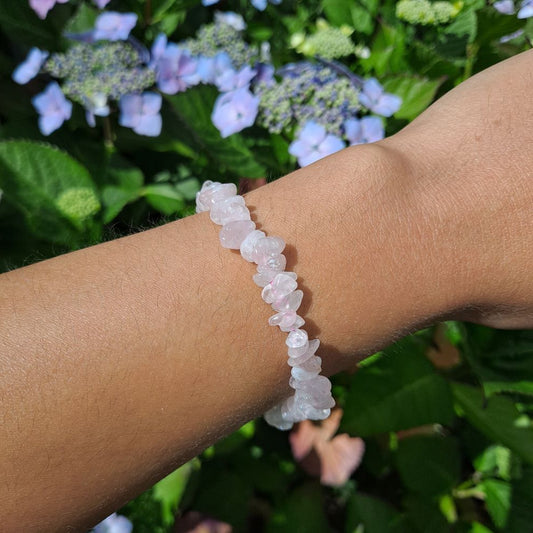 Dumi's Crystals | Rose Quartz Chip Stretch Bracelet (7 Inch) | Showcasing the captivating beauty of Rose Quartz chips on a wrist. This bracelet promotes emotional healing, self-love, and fosters harmony. Rose Quartz, the stone of unconditional love, is known for its delicate pink hues.