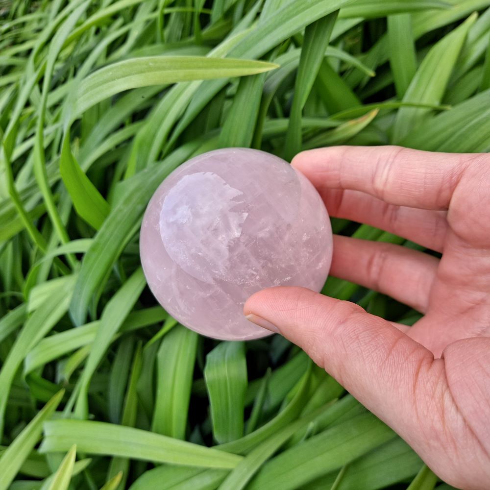 Cultivate Love & Healing with Rose Quartz (2.5 inch) | Dumi's Crystals | Enhance your meditation practice with this magnificent 2.5-inch Rose Quartz Sphere. It's believed to open the heart chakra, fostering love, compassion, and emotional well-being.
