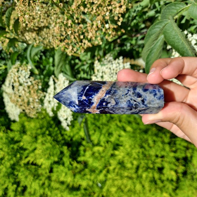 Unleash Your Inner Wisdom with Sodalite Tower | Dumi's Crystals | This captivating Sodalite Tower (7-11cm) radiates calming energy. Sodalite is thought to enhance focus, communication, and emotional balance.